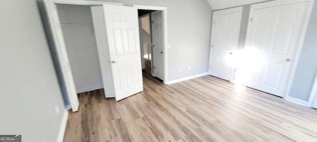 unfurnished bedroom featuring light wood-type flooring