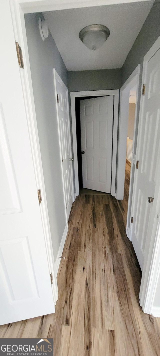 hallway featuring hardwood / wood-style floors