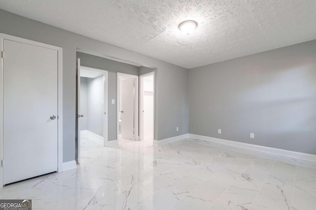 empty room with a textured ceiling