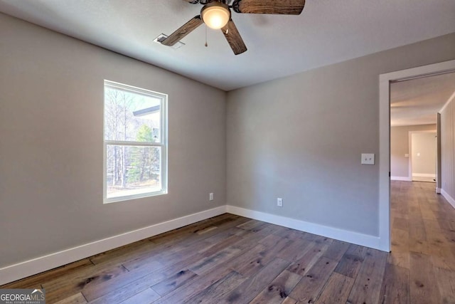 unfurnished room with hardwood / wood-style floors and ceiling fan