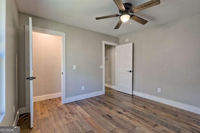 unfurnished bedroom with light hardwood / wood-style flooring and ceiling fan