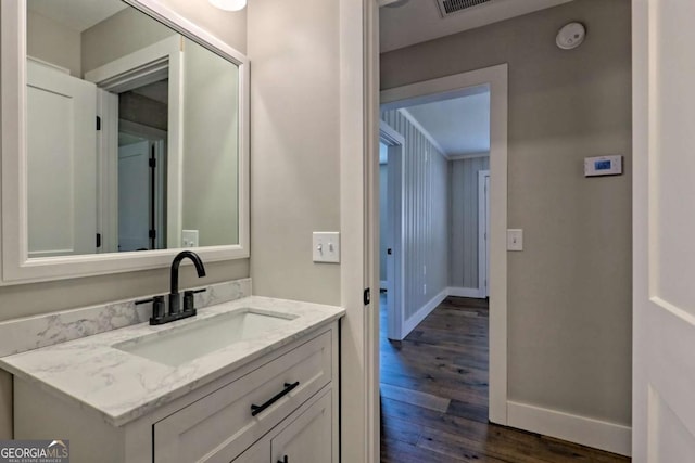 bathroom featuring vanity and hardwood / wood-style floors