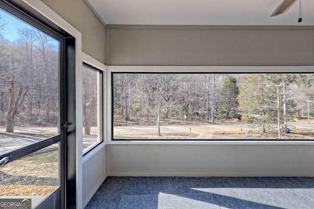 unfurnished sunroom featuring plenty of natural light