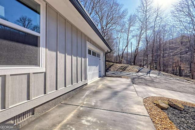 view of patio / terrace featuring a garage