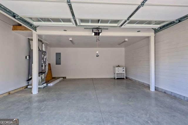 garage featuring a garage door opener and electric panel