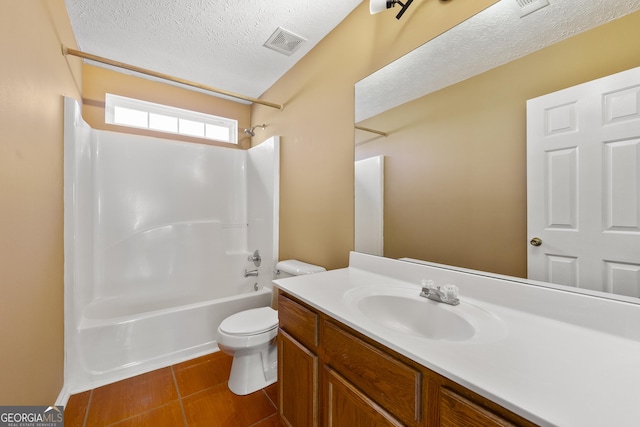 full bathroom featuring toilet, a textured ceiling, vanity, shower / bath combination, and tile patterned flooring