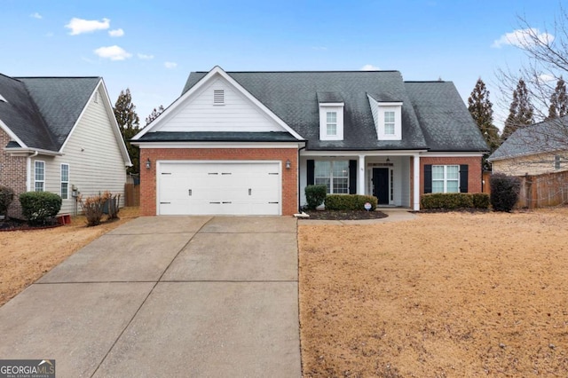 view of front of house with a garage and a porch