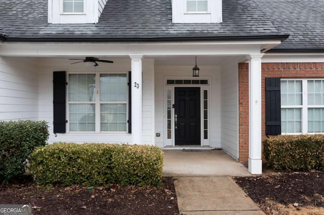 doorway to property featuring ceiling fan