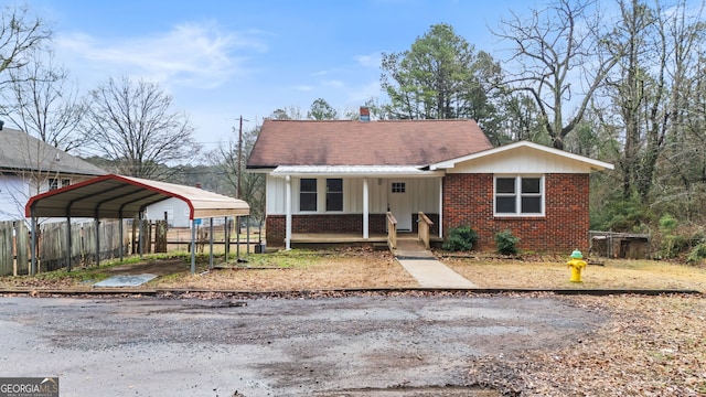 view of front facade featuring a carport and covered porch