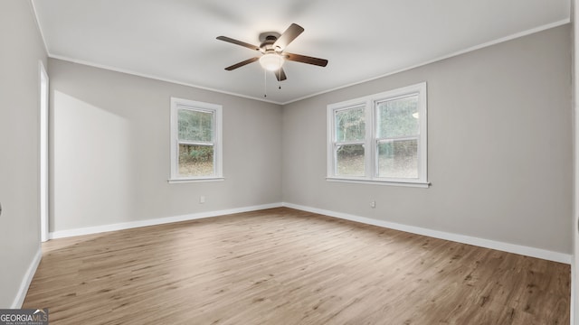 unfurnished room featuring crown molding, ceiling fan, and light wood-type flooring