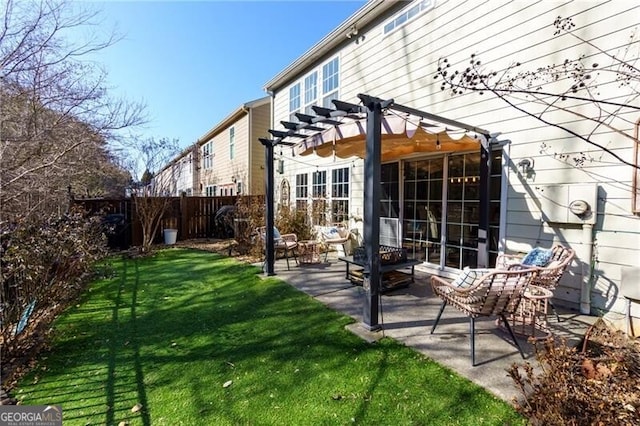 back of house featuring a yard, a pergola, and a patio