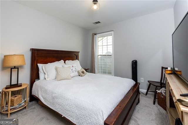 bedroom featuring light colored carpet