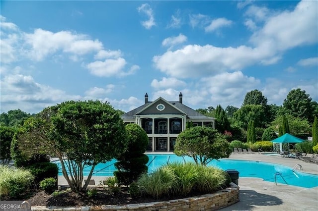 view of swimming pool featuring a patio area