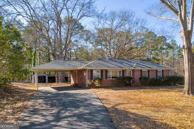 single story home featuring a carport