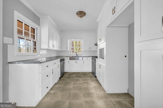 kitchen featuring sink, ornamental molding, stainless steel appliances, decorative backsplash, and white cabinets