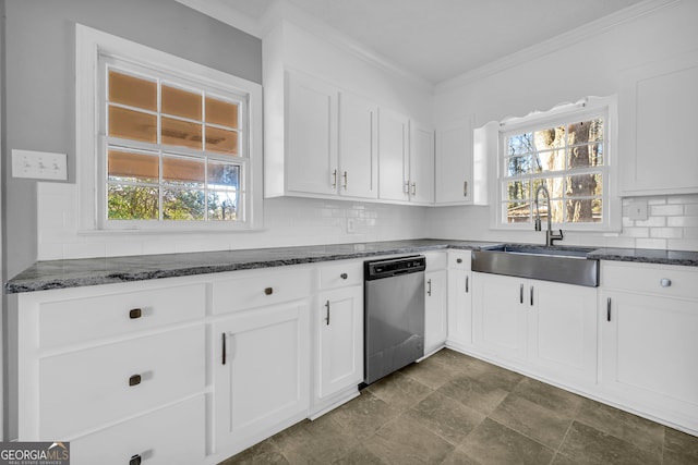 kitchen with dark stone countertops, sink, white cabinets, and dishwasher