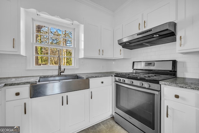 kitchen featuring gas range, crown molding, and white cabinets