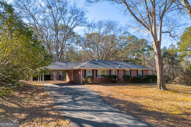 single story home with a carport