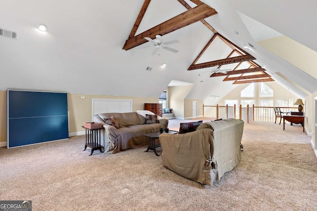 carpeted living room with ceiling fan, plenty of natural light, and lofted ceiling with beams