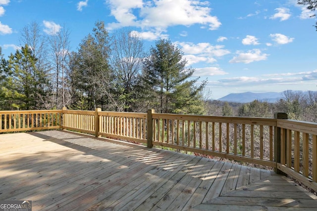 wooden terrace featuring a mountain view