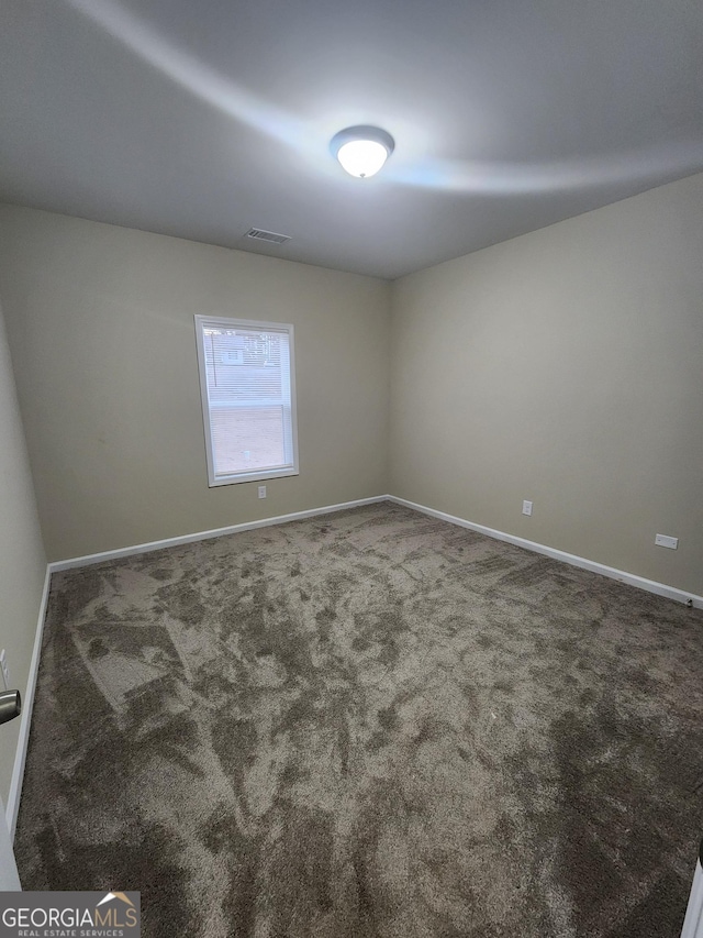 empty room featuring carpet flooring