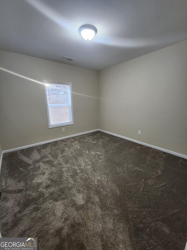 unfurnished room featuring carpet floors