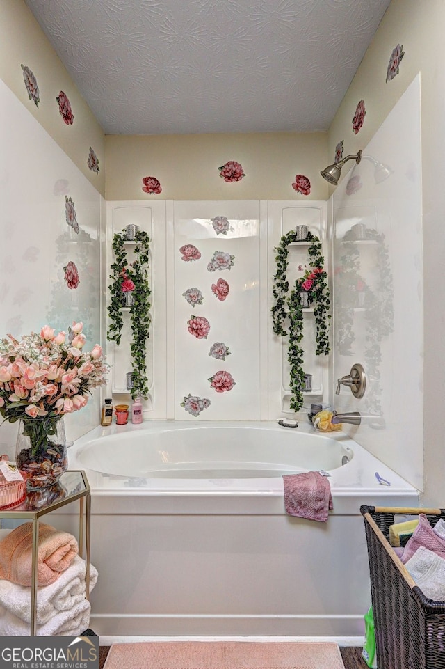 bathroom with shower / bathtub combination and a textured ceiling