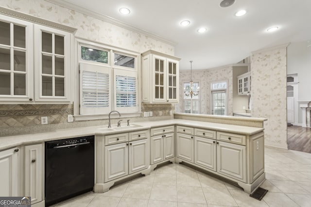 kitchen with sink, crown molding, dishwasher, an inviting chandelier, and hanging light fixtures