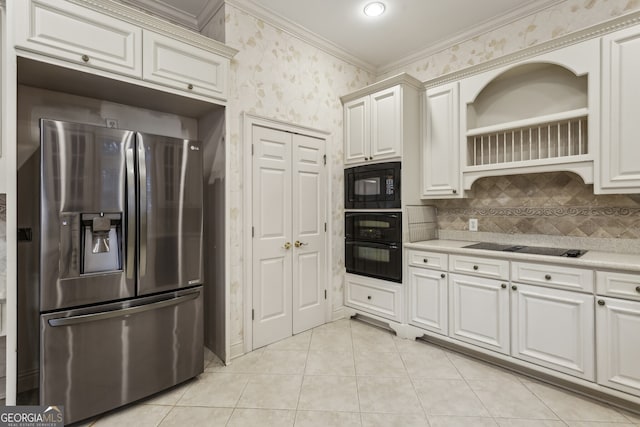 kitchen featuring light tile patterned flooring, white cabinets, decorative backsplash, black appliances, and crown molding