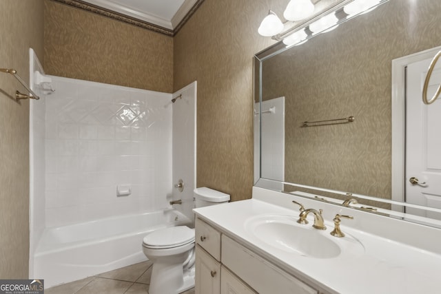 full bathroom featuring tiled shower / bath, ornamental molding, vanity, toilet, and tile patterned floors