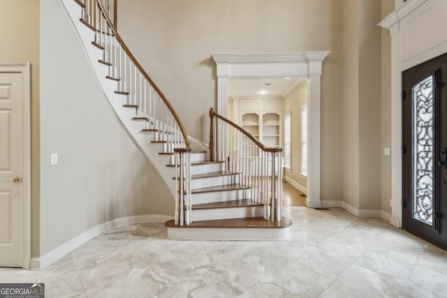 foyer entrance with a high ceiling