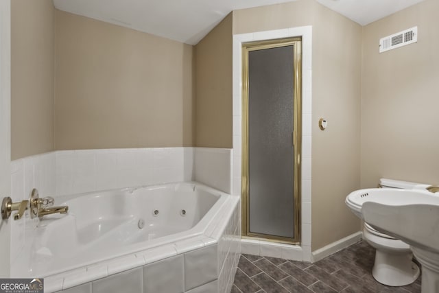 bathroom with shower with separate bathtub