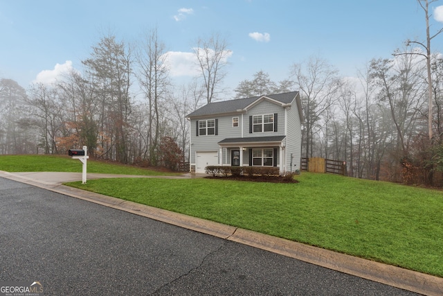 front facade featuring a garage and a front lawn