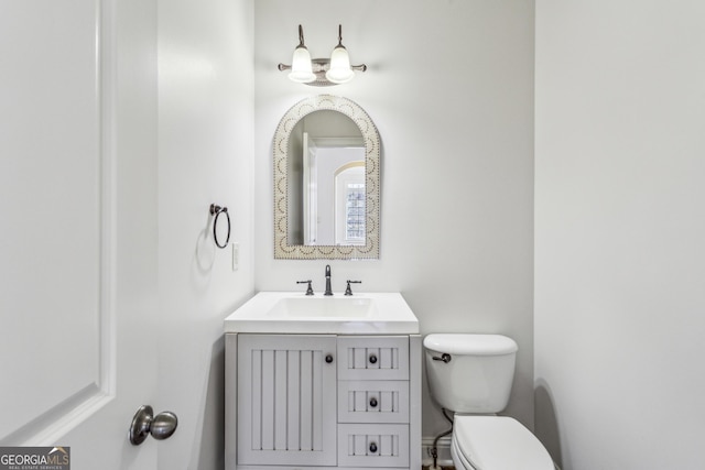 bathroom with vanity and toilet