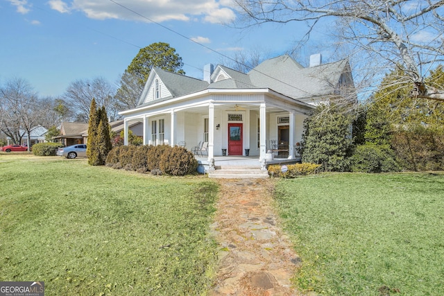 view of front of property featuring a front yard and covered porch