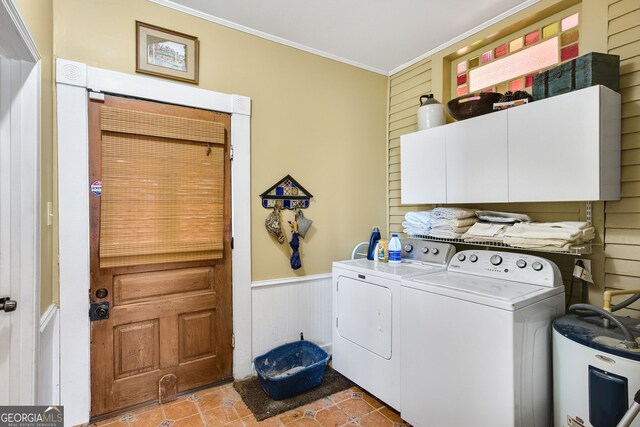 clothes washing area featuring light tile patterned floors, crown molding, water heater, cabinets, and separate washer and dryer