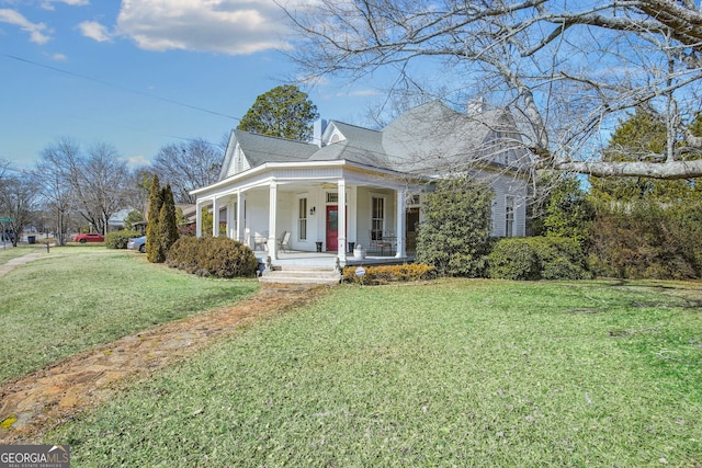 view of front facade with a front lawn and a porch