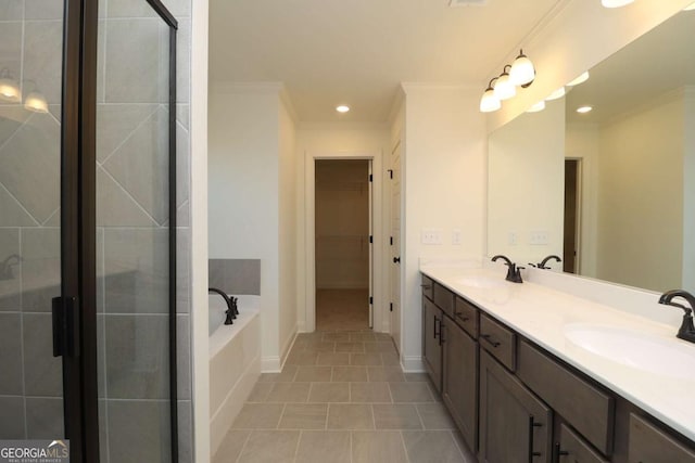 bathroom featuring crown molding, tile patterned floors, vanity, and plus walk in shower