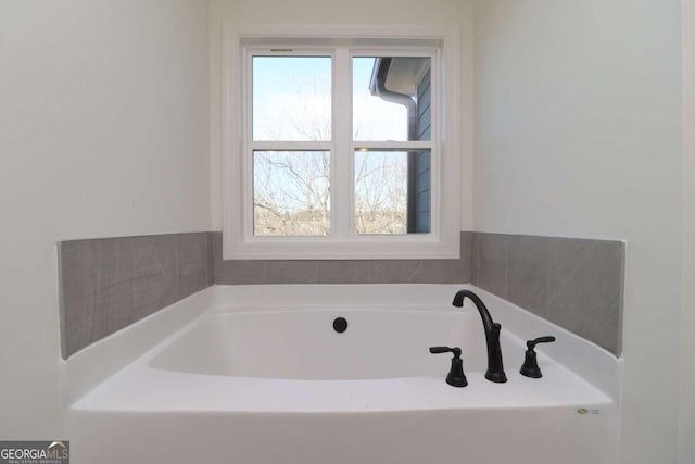 bathroom with a bathing tub