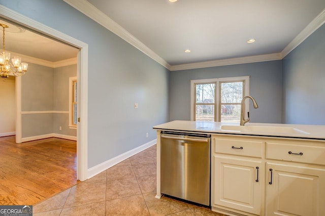 kitchen with light tile patterned flooring, dishwasher, sink, hanging light fixtures, and crown molding