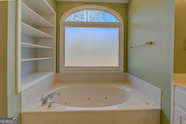 bathroom with vanity and a tub to relax in