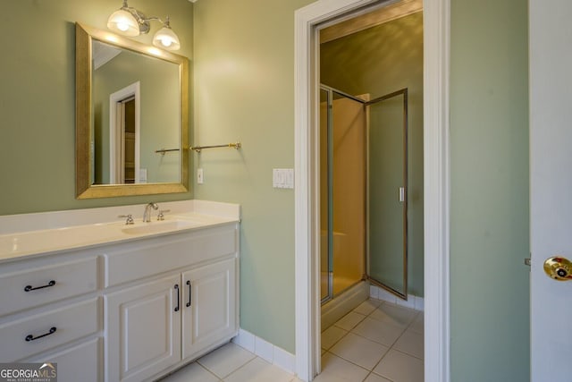 bathroom with vanity, tile patterned flooring, and a shower with door