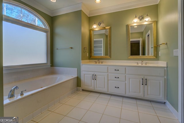 bathroom featuring vanity, a washtub, crown molding, and tile patterned floors