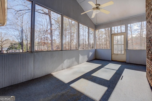 unfurnished sunroom featuring vaulted ceiling and ceiling fan