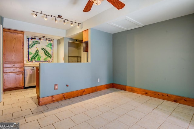 tiled empty room with rail lighting and ceiling fan