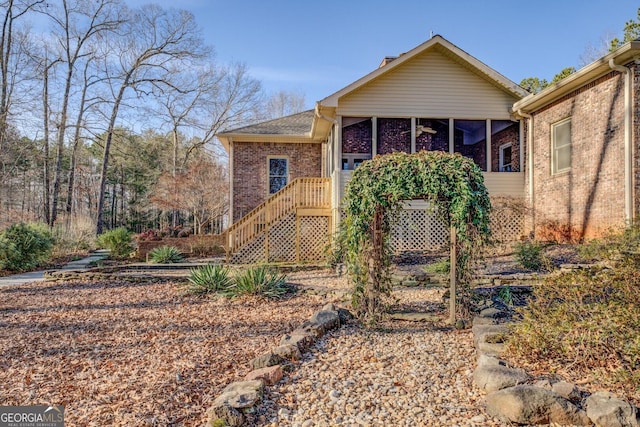 view of front of home featuring a sunroom