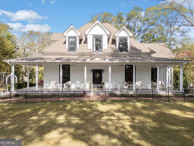 farmhouse inspired home with a front lawn and a porch