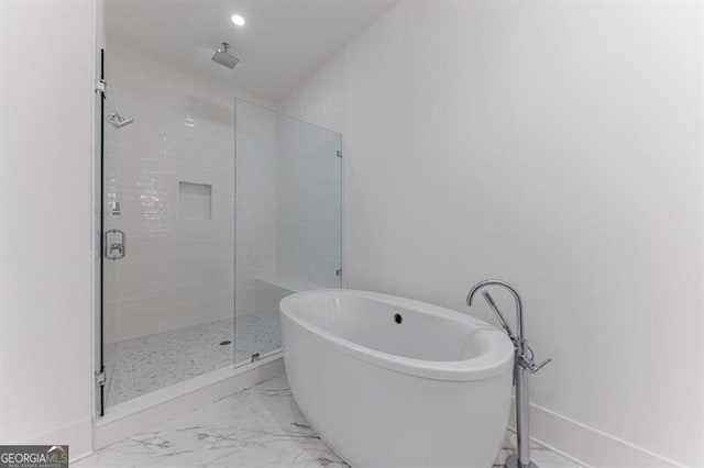 bathroom featuring plus walk in shower