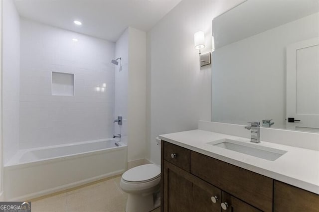 full bathroom featuring tile patterned floors, vanity, toilet, and tiled shower / bath combo