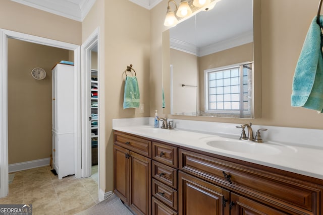 bathroom with vanity, crown molding, and tile patterned floors